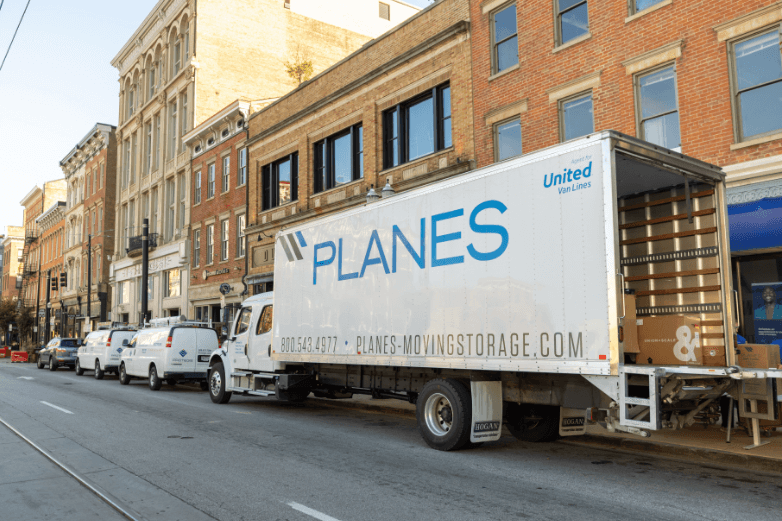 Planes moving truck parked on the street