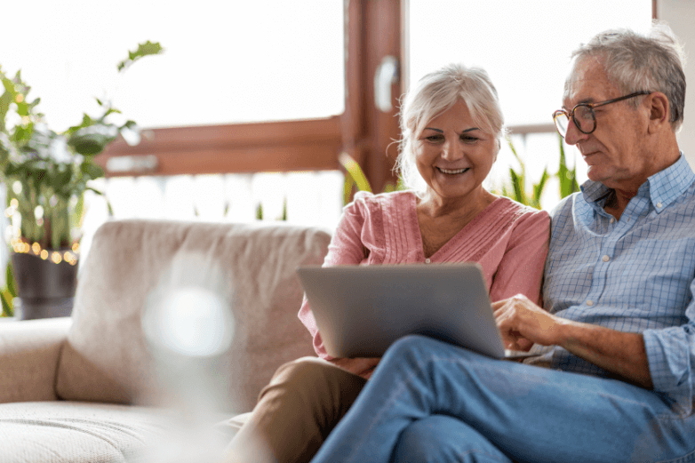 seniors using a laptop together