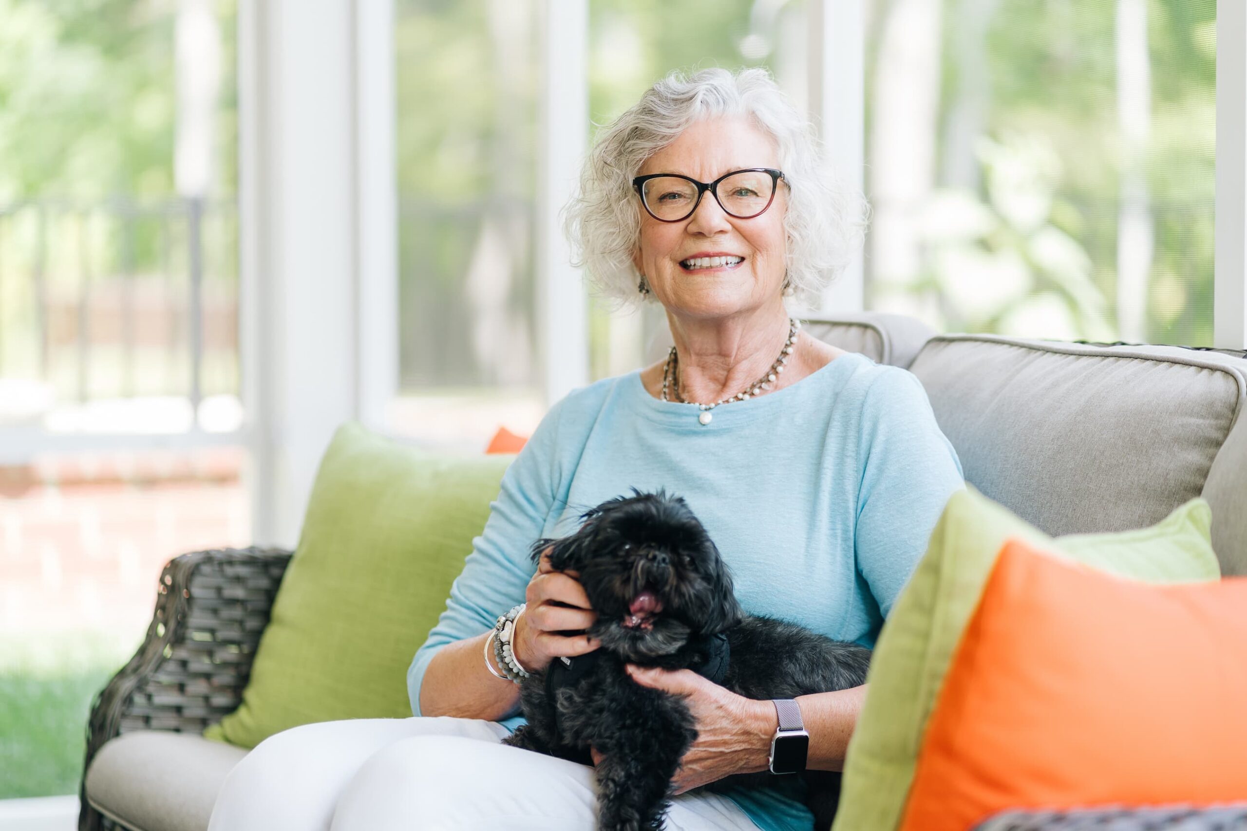 Lakewood senior woman sitting with dog